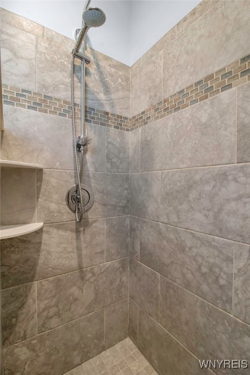 full bathroom with a tile shower