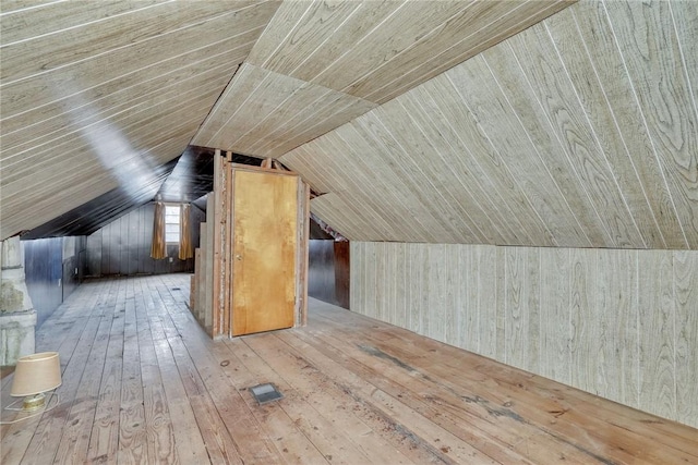 bonus room with wood-type flooring, wood ceiling, and vaulted ceiling