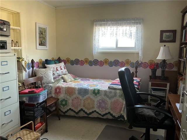 carpeted bedroom featuring crown molding