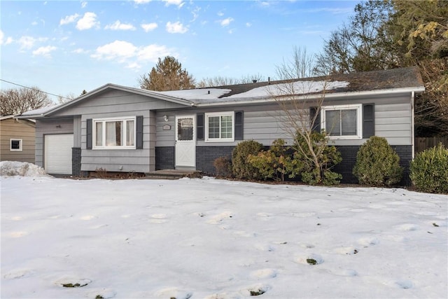 ranch-style house with an attached garage and brick siding