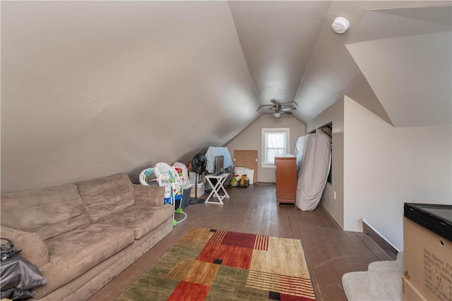 additional living space with wood-type flooring and lofted ceiling