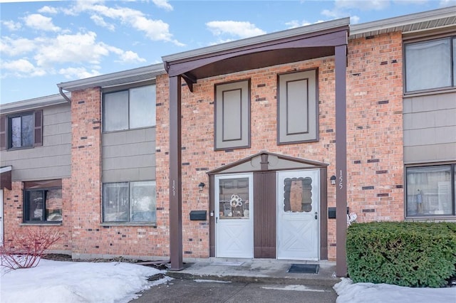 view of front of house with brick siding