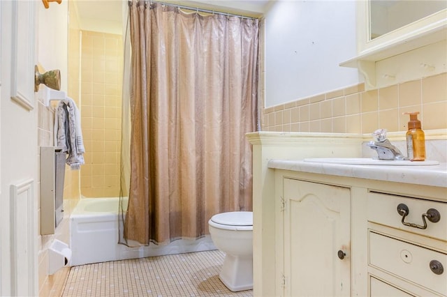 bathroom featuring shower / bathtub combination with curtain, toilet, backsplash, tile patterned flooring, and vanity