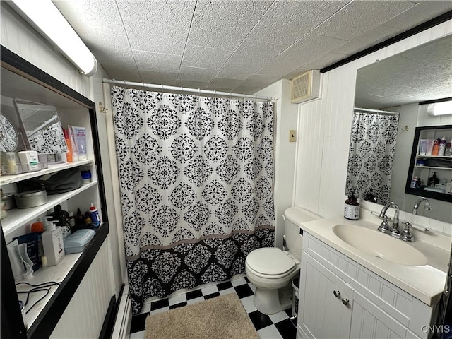 bathroom with vanity, tile patterned floors, curtained shower, and toilet