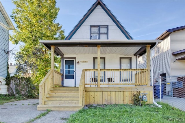 bungalow with fence and covered porch