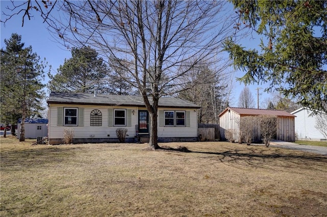 view of front of property with an outbuilding and a front yard