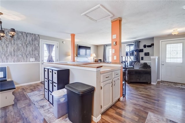 kitchen with a healthy amount of sunlight, open floor plan, and white cabinetry