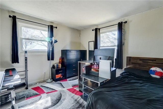 bedroom featuring baseboards