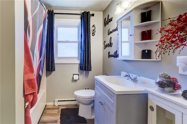 full bathroom with vanity, toilet, a healthy amount of sunlight, and a baseboard radiator