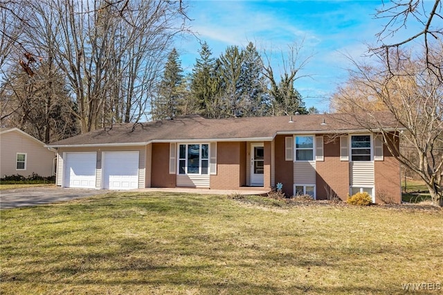 ranch-style home with driveway, brick siding, an attached garage, and a front lawn