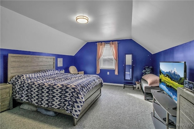 bedroom with baseboards, carpet, and vaulted ceiling