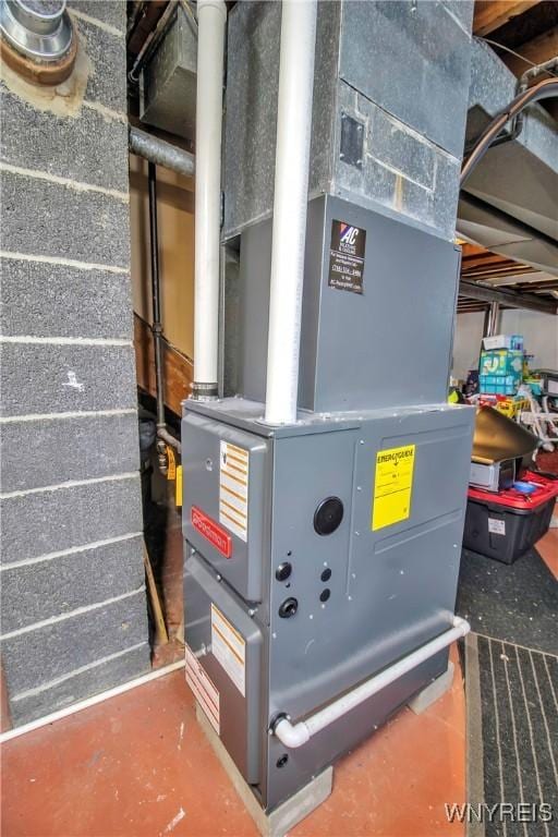 utility room with heating unit