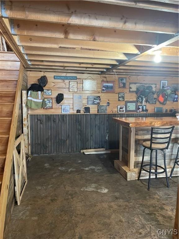 8558 Jackson Hill Rd, Boonville, NY 13309 - bar featuring a bar, wood walls, and concrete flooring