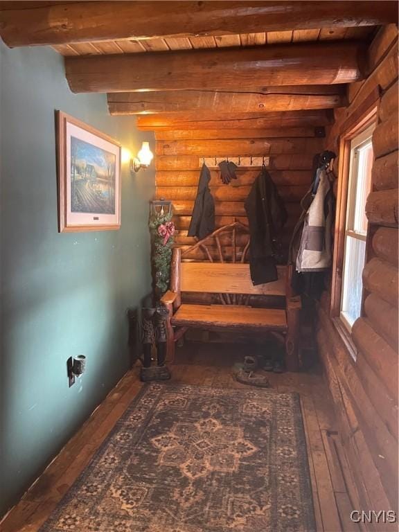 8558 Jackson Hill Rd, Boonville, NY 13309 - hallway featuring beam ceiling, wooden ceiling, hardwood / wood-style flooring, and log walls