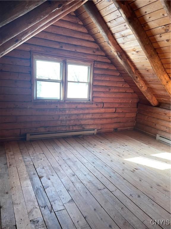 attic featuring a baseboard heating unit