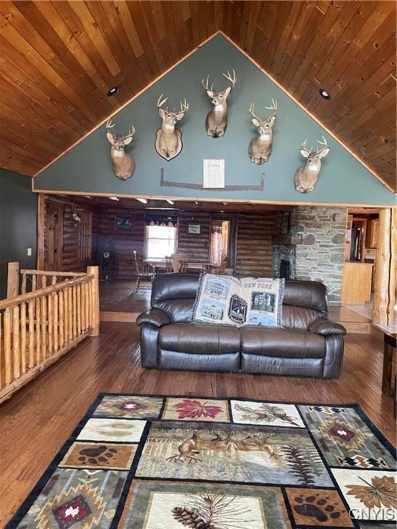 living room featuring wooden ceiling, high vaulted ceiling, and wood finished floors