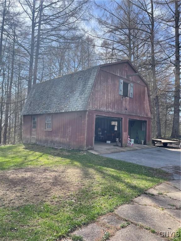8558 Jackson Hill Rd, Boonville, NY 13309 - view of barn with driveway and a yard