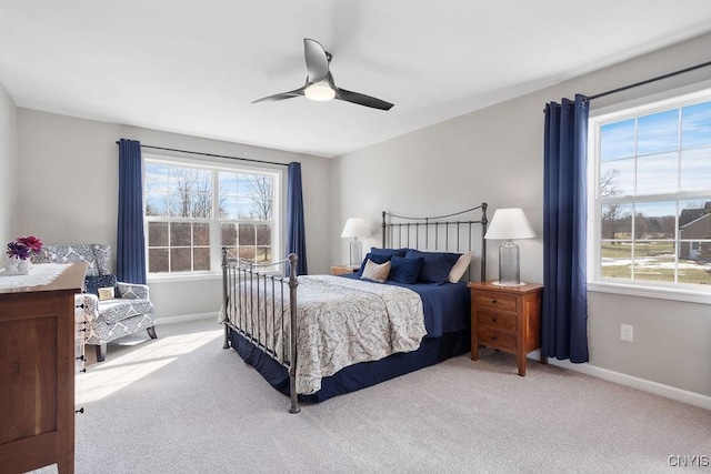 bedroom with baseboards, carpet, and a ceiling fan