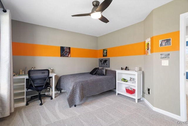 carpeted bedroom with a ceiling fan and baseboards