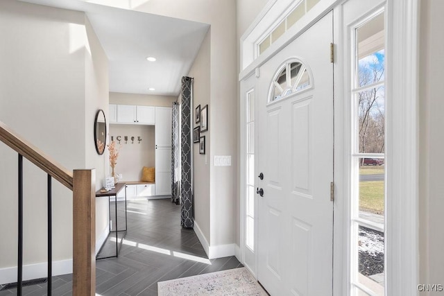 entryway featuring stairway, recessed lighting, and baseboards