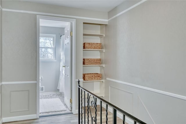 hallway with wood finished floors