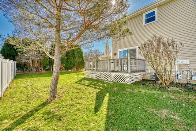 view of yard with a deck and fence