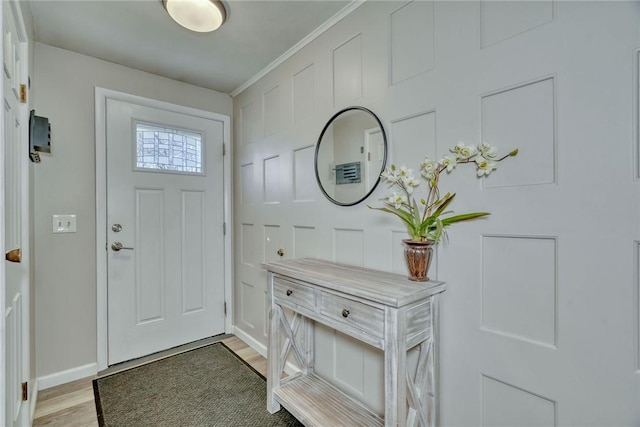 entryway with baseboards and light wood-style floors