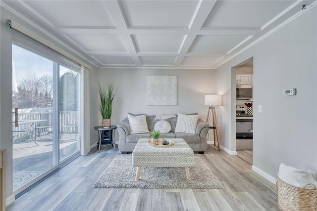 living room with beamed ceiling, coffered ceiling, baseboards, and wood finished floors