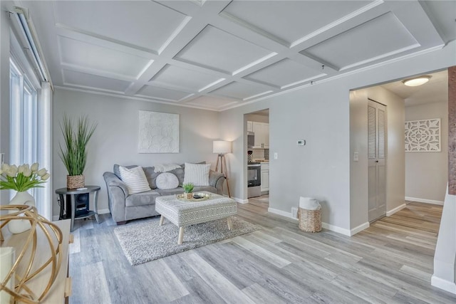 living room featuring light wood-style floors, baseboards, and coffered ceiling