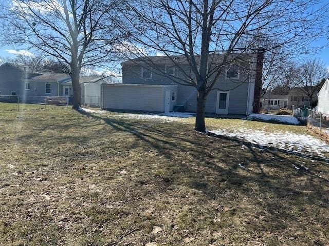 exterior space with dirt driveway and fence