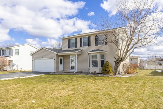 view of front of house with aphalt driveway, an attached garage, a front yard, and fence