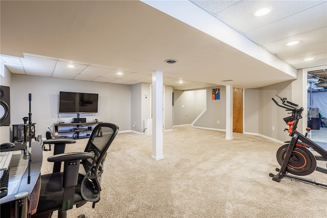 exercise area featuring recessed lighting, a paneled ceiling, baseboards, and carpet