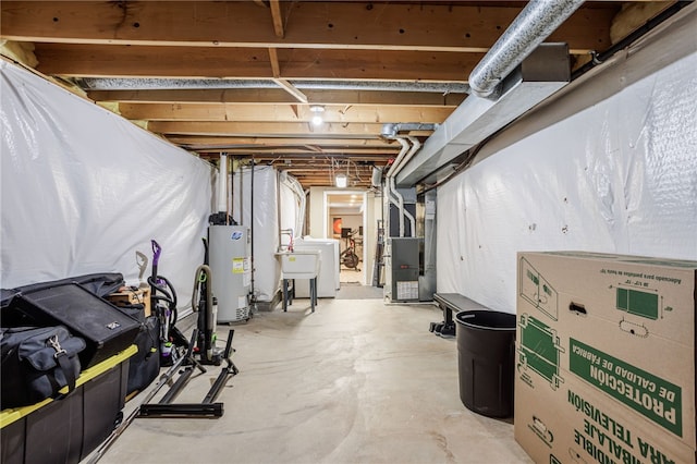 unfinished below grade area featuring gas water heater, heating unit, and a sink