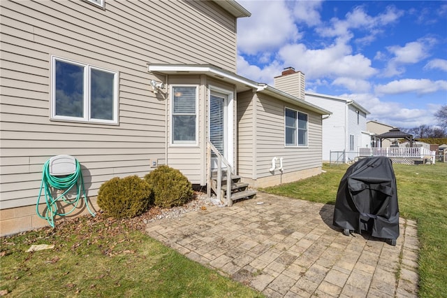 view of patio / terrace featuring entry steps, a gazebo, and a grill