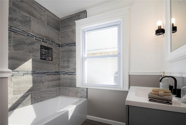 bathroom with vanity and baseboards