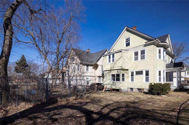 back of property with fence