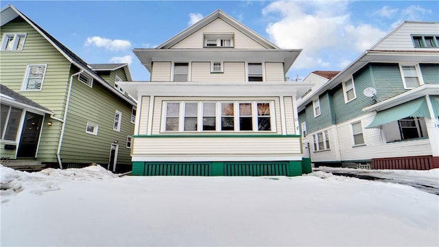 view of snow covered house