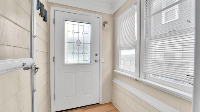 doorway to outside featuring light wood-style flooring