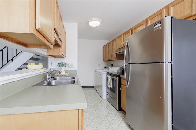 kitchen with light floors, separate washer and dryer, a sink, light countertops, and appliances with stainless steel finishes