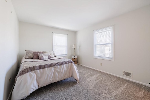 bedroom featuring visible vents, carpet flooring, and baseboards