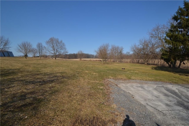 view of yard with a rural view