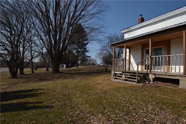 view of yard featuring covered porch