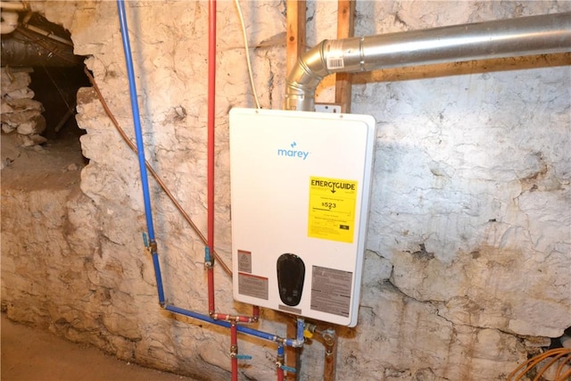 utility room featuring tankless water heater