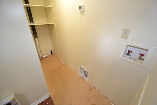 washroom featuring washer hookup, laundry area, and visible vents