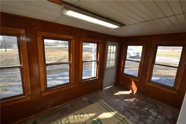 unfurnished sunroom with plenty of natural light