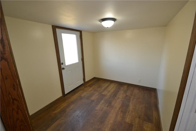 interior space with dark wood-style floors and baseboards