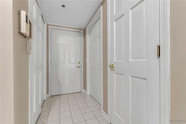 hall with light tile patterned flooring