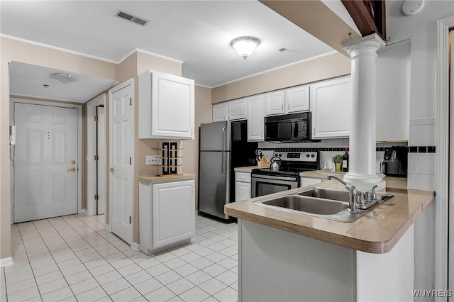 kitchen featuring visible vents, ornate columns, ornamental molding, a sink, and appliances with stainless steel finishes