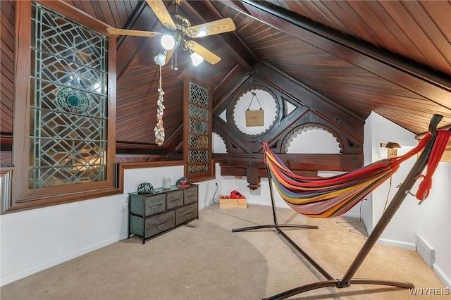 interior space featuring wooden ceiling, lofted ceiling with beams, and baseboards