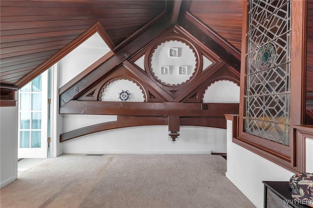 interior space featuring wood ceiling, carpet, and visible vents